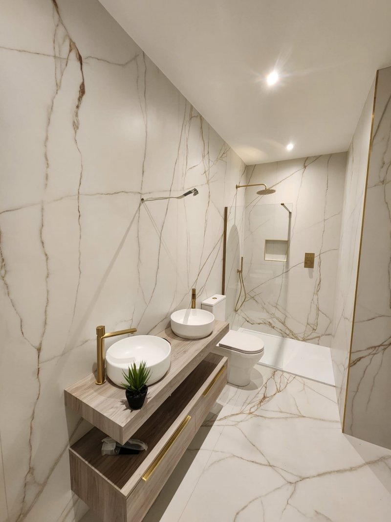 Professional wet room tiling Dublin marble porcelain tiles gold rainfall shower.