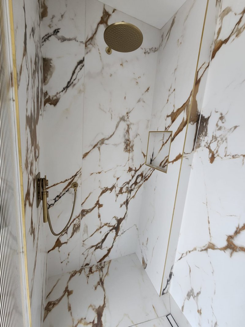 Luxury marble shower with gold rainfall showerhead by RC Tiling Dublin