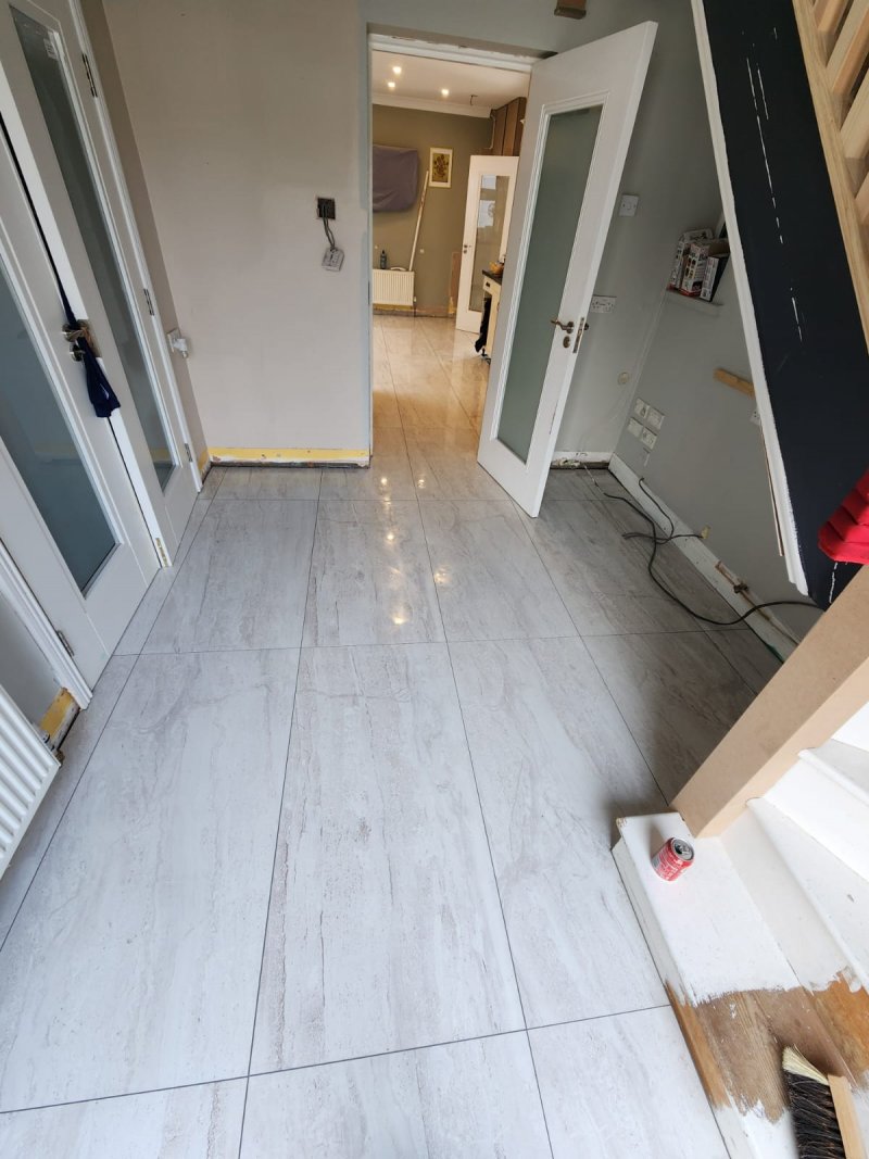 Large-format marble tile flooring in hallway and adjacent room – RC Tiling Dublin residential installation