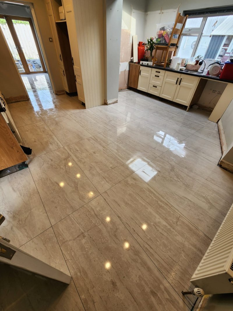 Large marble tile flooring with kitchen cabinet and countertop – RC Tiling Dublin installation