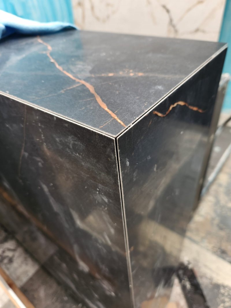 Close-up of black marble joint with gold veining – RC Tiling Dublin