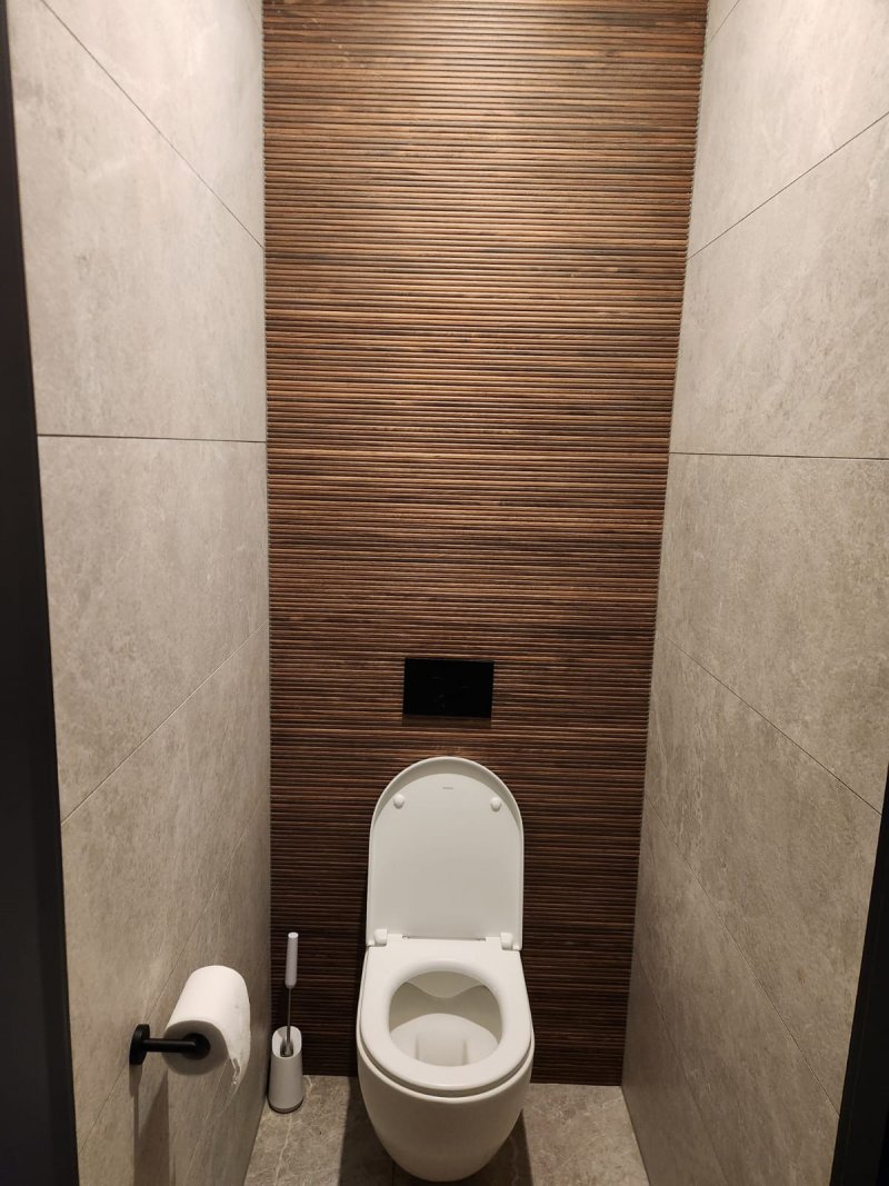 Toilet area with mosaic tile wall in beige and brown tones – RC Tiling Dublin