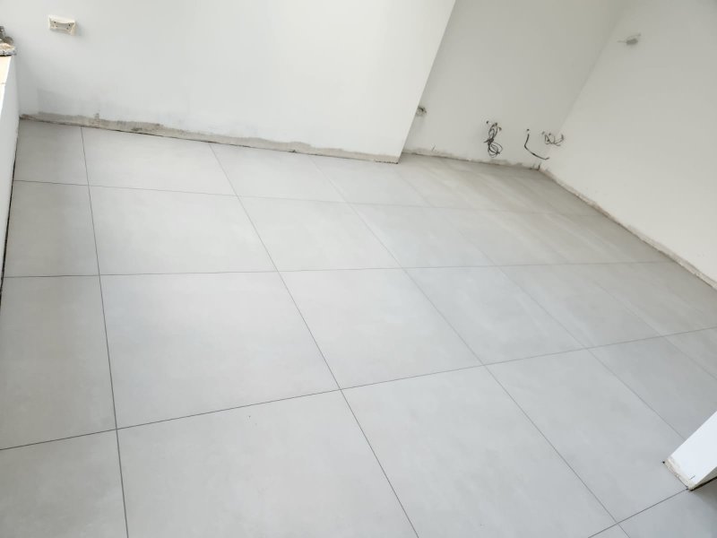 Close-up of perfectly aligned large white tiles in renovated room – RC Tiling Dublin