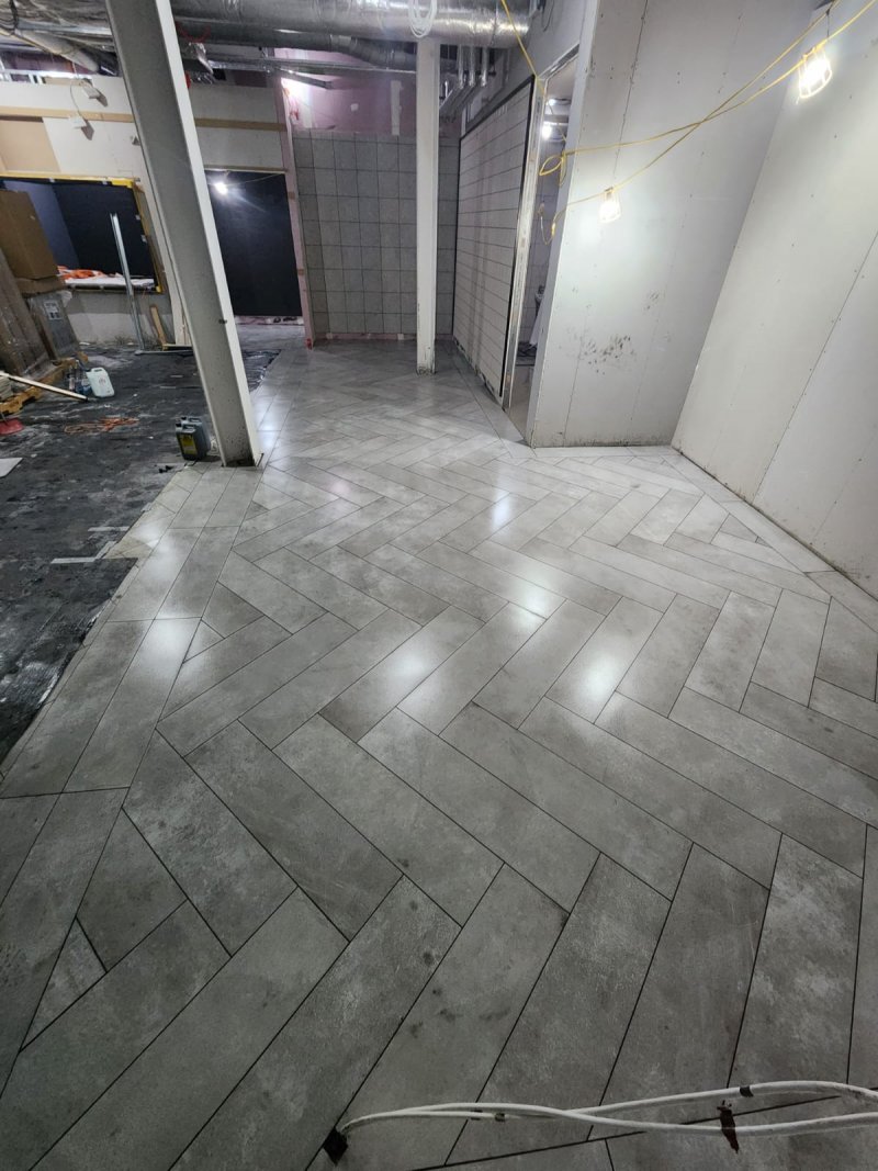 Full room view of herringbone stone tile flooring from corner perspective – RC Tiling Dublin  