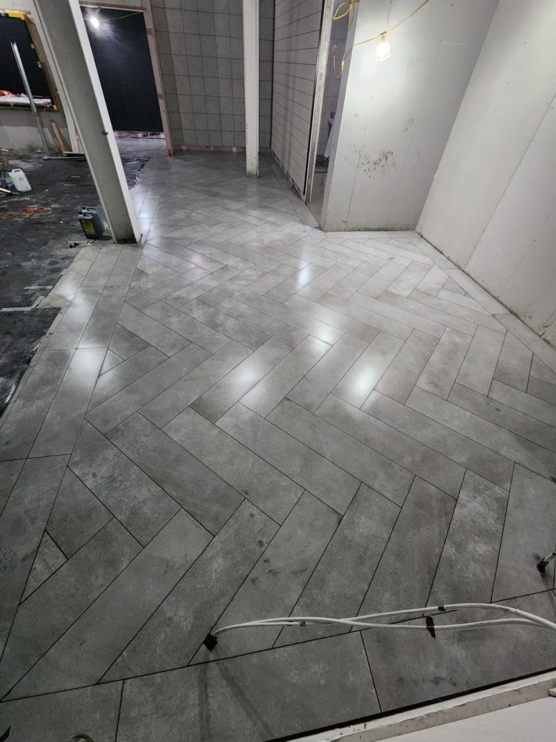 Hallway with stone-effect tiles in herringbone pattern – RC Tiling Dublin
