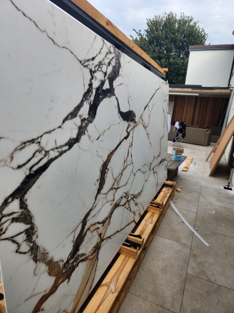 Unpacking a large marble slab (3m x 1.5m) with black and brown veining – RC Tiling Dublin
