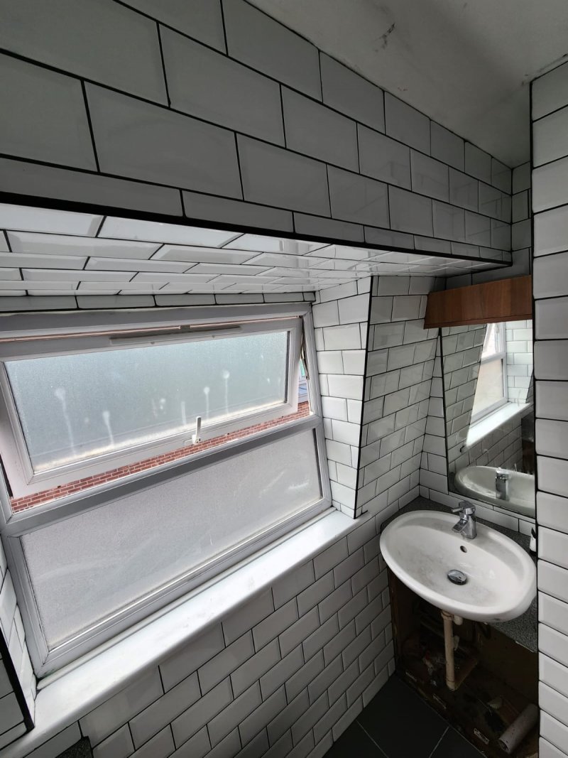Bathroom window wall with white ceramic tiles in brick pattern – RC Tiling Dublin