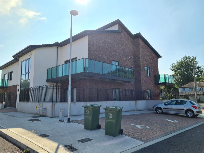 Finished glass balcony and stone-tiled courtyard in Dublin home – RC Tiling Dublin