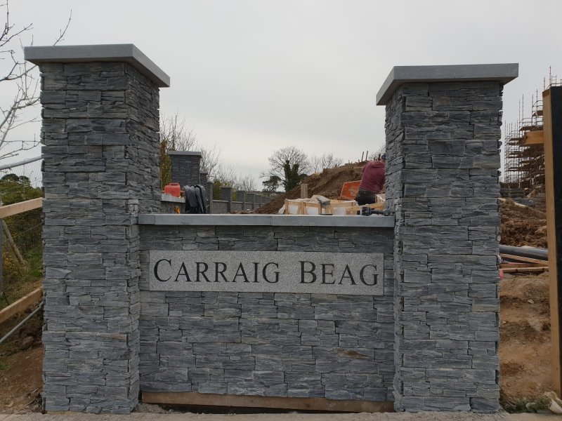 Finished stone entrance wall with engraved Carraig Beag plaque and pillars – RC Tiling Dublin