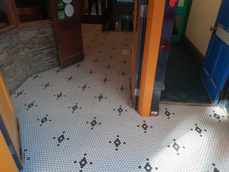 Entrance with hexagonal tile floor and stone veneer walls – RC Tiling Dublin