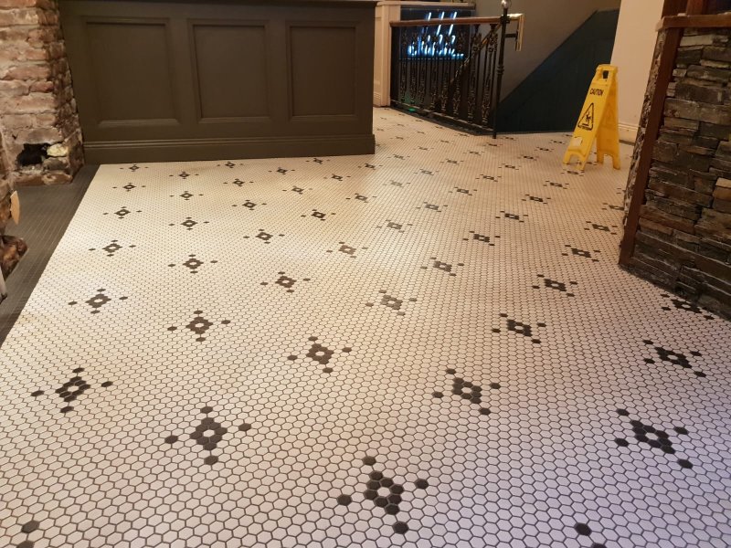 Hexagonal tile floor with black star pattern in restaurant lobby – RC Tiling Dublin