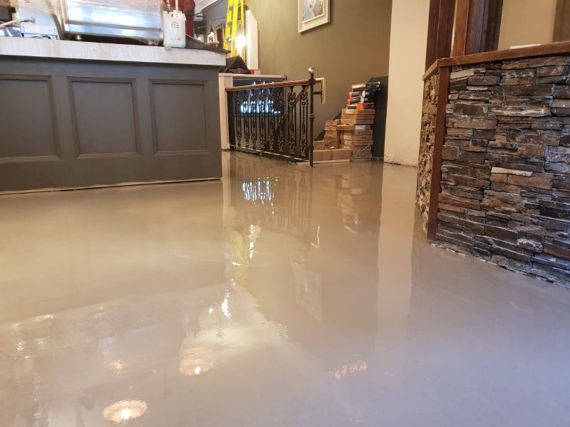 Smooth subfloor preparation using leveling compound for restaurant tiling in Dublin.