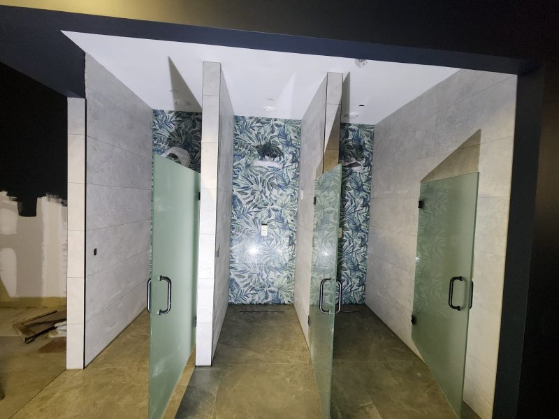 Open shower cabins with green and white large-format wall tiles – frontal view, RC Tiling Dublin